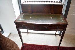A reproduction Regency style ladies writing desk having serpentine front, dimensions approx. W91 D57