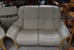 A modern Stressless lounge suite comprising two seater settee and single armchair (both recline) ,