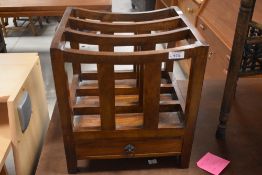 A modern hardwood Canterbury style magazine rack