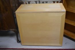 A modern kitchen table having pull out storage section , width approx 80cm