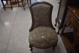 A Victorian mahogany nursing chair having knurl frame, width approx. 50cm