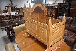 A bespoke pine rocking crib