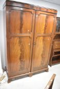 An early 20th Century mahogany double wardrobe, width approx. 138cm
