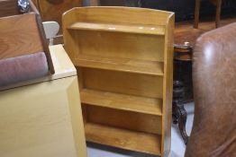 A vintage stained frame low bookcase, of graduated form, width approx. 60cm