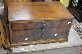 A vintage walnut three drawer cutlery canteen on legs (one broken)
