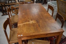 A vintage teak dining table of rectangular form on heavy square legs, approx 188 x 92cm