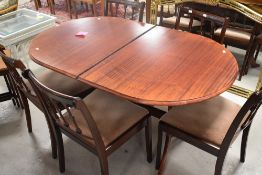 A vintage stained frame dining table of oval extending form, approx. 150 x 86 x 74cm