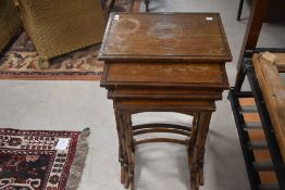 A reproduction mahogany quartetto nest of the tables in the Edwardian style (as found with damage to