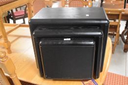 A modern black ash nest of three tables, of modular form, widest approx. 50cm