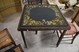 A traditional folding card table, labelled Vono, having foliate tapestry top, approx. 76 x 76cm