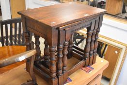 A nice quality reproduciton , possibly Titchmarsh and Goodwin, oak nest of three table, width