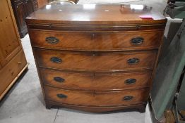 A nice quality reproduction Regency bow fronted chest of four long drawers (plus brushing slide),