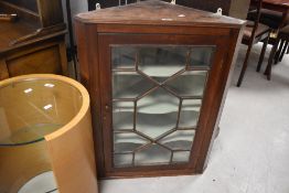 A 19th Century mahogany corner display having astral glazed door, height approx. 86cm