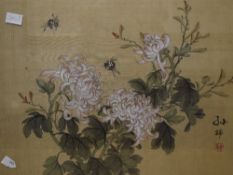 A pair of 20th century Chinese silk paintings, the first depicting chrysanthemums and bees and the
