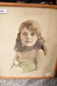 A vintage print of a young girl framed and glazed 37cm x 31cm.