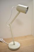 A modern Ikea TOLFT steel desktop work lamp, in the colour beige, 57cm at full extension.