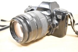 Canon EOS 1000 35mm film camera, with a Sigma Zoom 55-200mm f4-5.6 lens.