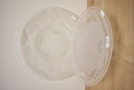 A modern etched glass plate with striped design, sold together with a pedestal bowl of conforming