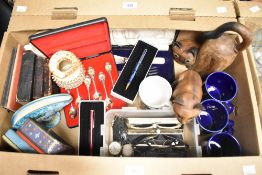 A miscellaneous selection of items including vintage tins, cased fish servers, two wooden cat