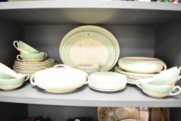 An Art Deco inspired part dinner service in cream with green banding to include soup bowls,