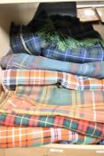 A selection of tartan fabric in a range of generous sizes all roughly two or three metres long so