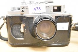 A Zorki 4K 35mm rangefinder camera with Jupiter-8 50mm f/2 Lens, with black leather case and strap.