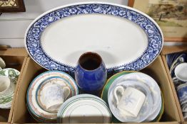 A large blue and white serving platter having blue and white banding with strawberry design, a large