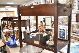 A wooden rolling tea trolley with drawer 74cm x 60cm x 40cm.