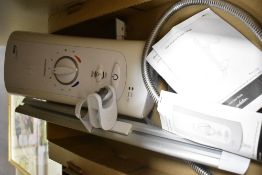 A Mira Advanced ATL Electric Shower with instructions and fittings.