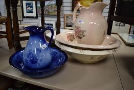 A Staffordshire water jug and bowl having pale pink glaze and rose pattern sold along with a smaller