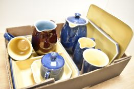A selection of Denby stoneware including serving dishes, teapot and milk jug etc.