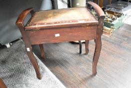 A vintage mahogany stained piano stool requiring a replacement cushion measuring 55cm x 55cm x