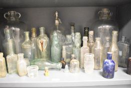 A group of early 20th century glass bottles, to include a Noble's Carlisle and Cochran & Co