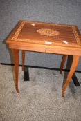 A reproduction inlaid marquetry side table having a flip top with inner storage. 49.5cm x 44.5cm x