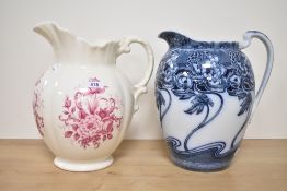 A large Ironstone water jug decorated with a pink floral motif sold together with a Kelm Scott