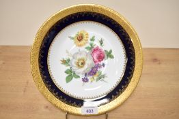 A Limoges porcelain plate hand painted with floral patterns, w23.5cm