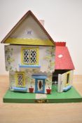 A Conway Valley dolls house with some sympathetic accessories and play pieces.