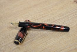 A Parker Duofold Callenger Standard button fill fountain pen in Red and Black marble with three