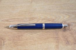 A boxed Pilot Vanishing Point converter fill fountain pen in Blue Carbonesque. With papers