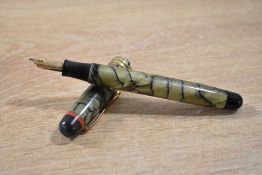 A rare Esterbrook Relief 3-S button fill fountain pen in green reverse cracked ice with three narrow
