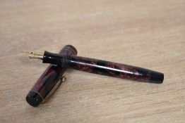 A Parker Duofold Junior button fill fountain pen in Burgundy and Black marble with two narrow cap