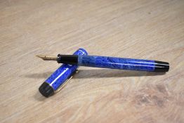 A boxed De LA Rue Onoto button fill fountain pen in Blue Marble with single cap band having De LA