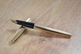 A Parker 65 Insignia converter fill fountain pen having Parker 14K 585 nib