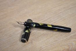 A Parker Duofold Deluxe Challenger Standard button fill fountain pen in Green and Black marble