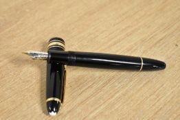 A Montblanc Meisterstuck cartridge fill fountain pen (MK1073238) in black with gold trim having 4810