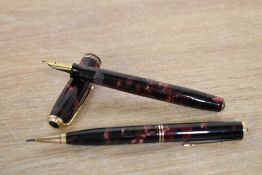 A Parker Duofold Junior button fill fountain pen and Propelling pencil in Burgundy and Black