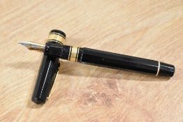 A boxed Omas Arte Italiana piston fill fountain pen in Black, this multi-faceted pen with greek