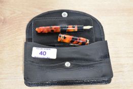 A Conway Stewart Dinkie series cartridge converter fill fountain pen in Meteor No381/017 with two