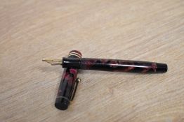 A Parker Duofold Junior button fill fountain pen in Burgundy and Black marble with two narrow cap