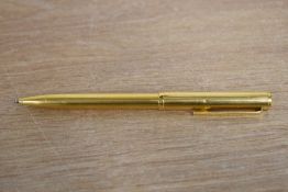 A Dunhill ballpoint pen in gold colour